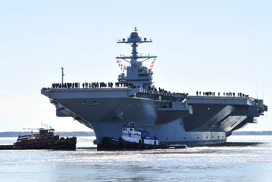 Атомный авианосец USS Gerald R. Ford (CVN 78) ВМС США получили 22 июля. Корабль считается самым дорогим в мире (13 миллиардов долларов), в 2020 году заменит авианосец USS Enterprise (CVN 65).
На корабле предусмотрено размещение более 4,5 тысяч военных и 75 самолетов, он оснащен зенитными ракетами «корабль-воздух» средней дальности RIM-162 ESSM, корабельным зенитно-ракетным и зенитно-артиллерийским комплексами. Водоизмещение корабля — 100 тысяч тонн, длина — 332,8 метра, ширина — 40,8 метра (ватерлиния), 78 метров (полетная палуба). Максимальная скорость составляет 30 узлов. Срок службы составит не менее 50 лет. USS Gerald R. Ford на базе ВМС США Норфолк