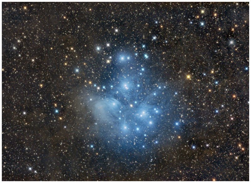 As Plêiades (M45) são o mais brilhante aglomerado de estrelas no céu.  Este grupo, também conhecido como o "Sete Irmãs", como se montando na parte de trás da constelação de Taurus interessante, espaço, beleza, ciência, foto