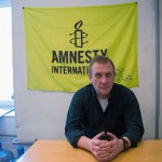 Amnesty International Russia chief, Sergei Nikitin speaks to The Associated Press in his office in Moscow, Russia, on Monday, March 25, 2013, after Russian prosecutors and tax police searched the Moscow headquarters of Amnesty International. The NGO Amnasty International and several other rights groups were seached Monday, continuing a wave of pressure that activists say is part of President Vladimir Putin's attempt to stifle dissent. (AP Photo/Ivan Sekretarev)