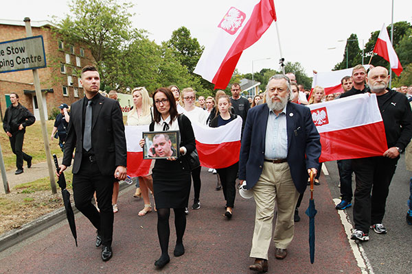 Members of the Polish and local community join a silent march in Harlow, Essex, Britain, 03 September 2016, to pay tribute to Polish national Arkadiusz Jozwik (seen on picture in foreground) who was murdered outside a takeaway shop in Harlow on 27 August 2016.