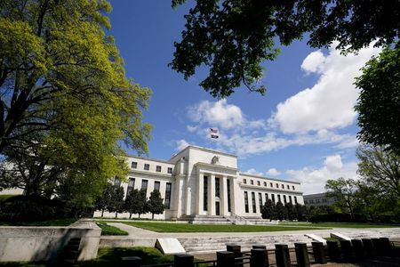 FILE PHOTO: The Federal Reserve building is set against a blue sky in Washington, U.S., May 1, 2020. REUTERS/Kevin Lamarque/File Photo  FILE PHOTO: The Federal Reserve building is set against a blue sky in Washington, U.S., May 1, 2020. REUTERS/Kevin Lamarque/File Photo