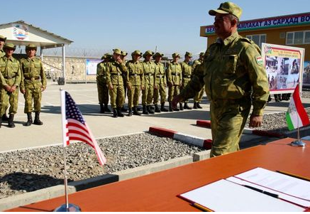 Tajik servicemen take part in a ceremony opening the "Okmazor" frontier post in Hamadoni district, some 200 km (124 miles) south of the capital Dushanbe, November 6, 2012. The construction of the frontier post on the Tajik-Afghan border was financially supported by the United States, according to local media. REUTERS/Nozim Kalandarov (TAJIKISTAN - Tags: POLITICS MILITARY) Tajik servicemen take part in a ceremony opening the "Okmazor" frontier post in Hamadoni district, some 200 km (124 miles) south of the capital Dushanbe, November 6, 2012. The construction of the frontier post on the Tajik-Afghan border was financially supported by the United States, according to local media. REUTERS/Nozim Kalandarov (TAJIKISTAN - Tags: POLITICS MILITARY)