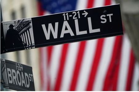 A Wall Street sign is pictured outside the New York Stock Exchange in the Manhattan borough of New York City, New York, U.S., October 2, 2020. REUTERS/Carlo Allegri A Wall Street sign is pictured outside the New York Stock Exchange in the Manhattan borough of New York City, New York, U.S., October 2, 2020. REUTERS/Carlo Allegri