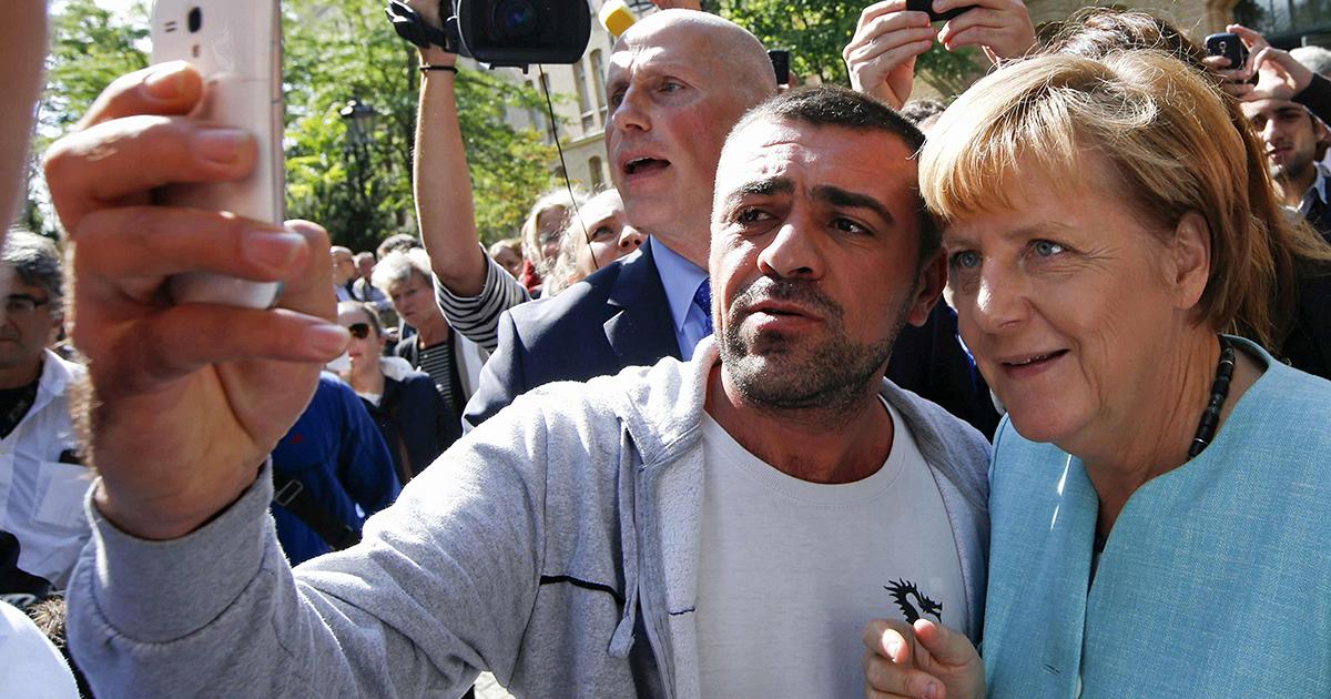 1200x630_313254_migrants-angela-merkel-visits-berli-1