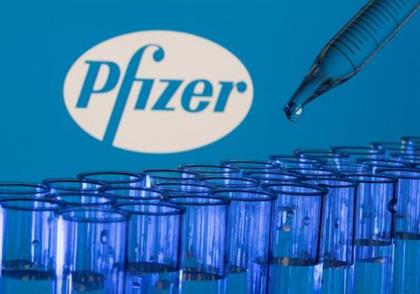 Test tubes are seen in front of a displayed Pfizer logo in this illustration taken, May 21, 2021. REUTERS/Dado Ruvic/Illustration Test tubes are seen in front of a displayed Pfizer logo in this illustration taken, May 21, 2021. REUTERS/Dado Ruvic/Illustration