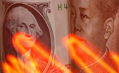 Chinese Yuan and U.S. dollar banknotes are seen behind illuminated stock graph in this illustration taken February 10, 2020. REUTERS/Dado Ruvic/Illustration Chinese Yuan and U.S. dollar banknotes are seen behind illuminated stock graph in this illustration taken February 10, 2020. REUTERS/Dado Ruvic/Illustration