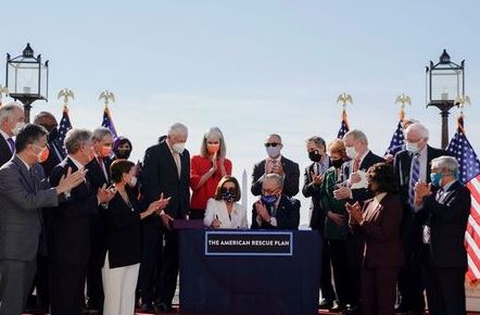 House Speaker Nancy Pelosi (D-CA) signs the "American Rescue Plan" as and Senate Majority Leader Chuck Schumer applauds during the enrolment ceremony following passage of U.S. President Joe Biden's $1.9 trillion coronavirus disease (COVID-19) relief bill on Capitol Hill in Washington, U.S., March 10, 2021. REUTERS/Erin Scott House Speaker Nancy Pelosi (D-CA) signs the "American Rescue Plan" as and Senate Majority Leader Chuck Schumer applauds during the enrolment ceremony following passage of U.S. President Joe Biden's $1.9 trillion coronavirus disease (COVID-19) relief bill on Capitol Hill in Washington, U.S., March 10, 2021. REUTERS/Erin Scott