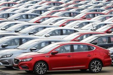 FILE PHOTO: Cars for export wait to be loaded onto cargo vessels at a port in Lianyungang, Jiangsu province, China October 14, 2019. REUTERS/Stringer FILE PHOTO: Cars for export wait to be loaded onto cargo vessels at a port in Lianyungang, Jiangsu province, China October 14, 2019. REUTERS/Stringer