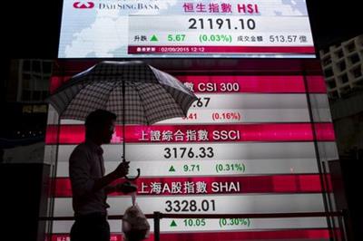 A man walks past a panel displaying figures of China stock indexes and Hang Seng Index at the financial Central district in Hong Kong, China September 2, 2015. China stocks clawed back sharp early losses on Wednesday amid speculation that the government is putting fresh pressure on brokerages to support the market. REUTERS/Tyrone Siu A man walks past a panel displaying figures of China stock indexes and Hang Seng Index at the financial Central district in Hong Kong, China September 2, 2015. China stocks clawed back sharp early losses on Wednesday amid speculation that the government is putting fresh pressure on brokerages to support the market. REUTERS/Tyrone Siu
