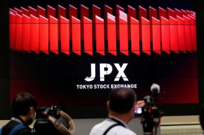 FILE PHOTO: TV camera men wait for the opening of market in front of a large screen showing stock prices at the Tokyo Stock Exchange in Tokyo, Japan October 2, 2020. REUTERS/Kim Kyung-Hoon/File Photo FILE PHOTO: TV camera men wait for the opening of market in front of a large screen showing stock prices at the Tokyo Stock Exchange in Tokyo, Japan October 2, 2020. REUTERS/Kim Kyung-Hoon/File Photo