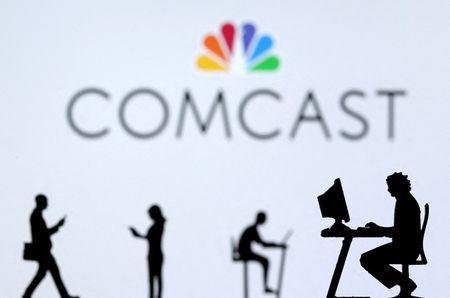 FILE PHOTO: Small toy figures with laptops and smartphones are seen in front of a displayed Comcast logo in this illustration taken December 5, 2021. REUTERS/Dado Ruvic/Illustration/File Photo GLOBAL BUSINESS WEEK AHEAD  FILE PHOTO: Small toy figures with laptops and smartphones are seen in front of a displayed Comcast logo in this illustration taken December 5, 2021. REUTERS/Dado Ruvic/Illustration/File Photo GLOBAL BUSINESS WEEK AHEAD