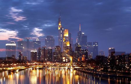 The skyline is photographed during sunset as the spread of the coronavirus disease (COVID-19) continues in Frankfurt, Germany, April 18, 2021. Picture taken with zoom effect during long time exposure. REUTERS/Kai Pfaffenbach The skyline is photographed during sunset as the spread of the coronavirus disease (COVID-19) continues in Frankfurt, Germany, April 18, 2021. Picture taken with zoom effect during long time exposure. REUTERS/Kai Pfaffenbach