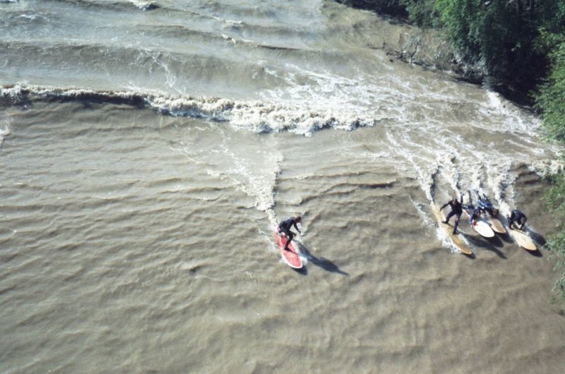 River surfing the front wave of the Severn tidal bore.