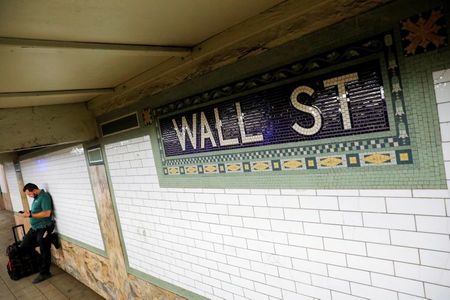 FILE PHOTO: A person waits on the Wall Street subway platform in the Financial District of Manhattan, New York City, U.S., August 20, 2021. REUTERS/Andrew Kelly FILE PHOTO: A person waits on the Wall Street subway platform in the Financial District of Manhattan, New York City, U.S., August 20, 2021. REUTERS/Andrew Kelly