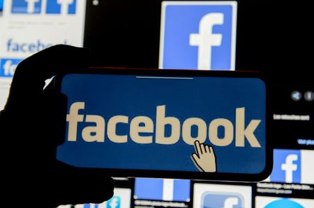 FILE PHOTO: The Facebook logo is displayed on a mobile phone in this picture illustration taken December 2, 2019. REUTERS/Johanna Geron/Illustration/File Photo FILE PHOTO: The Facebook logo is displayed on a mobile phone in this picture illustration taken December 2, 2019. REUTERS/Johanna Geron/Illustration/File Photo