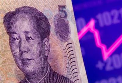 A Chinese Yuan banknote is seen in front of displayed stock graph in this illustration taken May 7, 2021. REUTERS/Dado Ruvic/Illustration A Chinese Yuan banknote is seen in front of displayed stock graph in this illustration taken May 7, 2021. REUTERS/Dado Ruvic/Illustration
