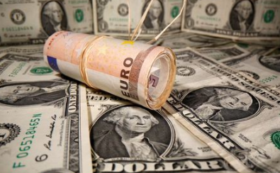 Rolled Euro banknotes are placed on U.S. Dollar banknotes in this illustration taken May 26, 2020. REUTERS/Dado Ruvic/Illustration Rolled Euro banknotes are placed on U.S. Dollar banknotes in this illustration taken May 26, 2020. REUTERS/Dado Ruvic/Illustration