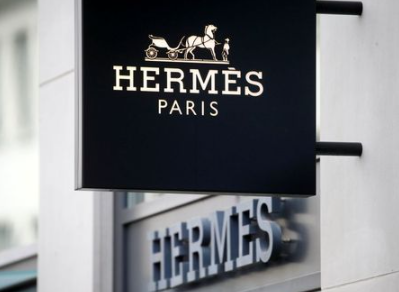 FILE PHOTO: The logo of French luxury group Hermes is seen at a store, as the spread of the coronavirus disease (COVID-19) continues, in Zurich, Switzerland February 17, 2021. REUTERS/Arnd Wiegmann/File Photo FILE PHOTO: The logo of French luxury group Hermes is seen at a store, as the spread of the coronavirus disease (COVID-19) continues, in Zurich, Switzerland February 17, 2021. REUTERS/Arnd Wiegmann/File Photo