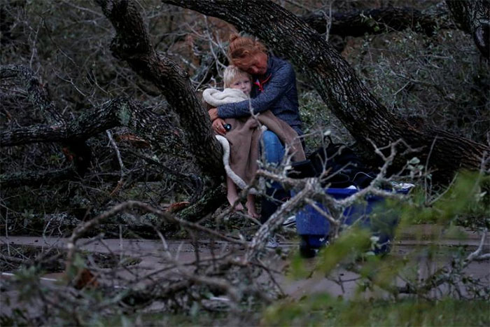 Lisa Rehr Holds Her Four-Year Old Son Maximus, After They Lost Their Home To Hurricane Harvey, As They Await To Be Evacuated With Their Belongings From Rockport