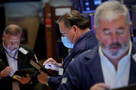 Traders work on the floor of the New York Stock Exchange (NYSE) in New York City, U.S., December 1, 2021. REUTERS/Brendan McDermid Traders work on the floor of the New York Stock Exchange (NYSE) in New York City, U.S., December 1, 2021. REUTERS/Brendan McDermid