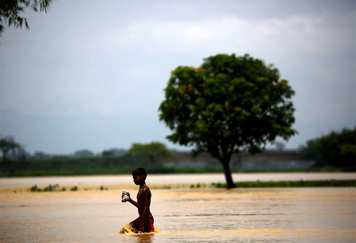 A Boy Walks Along Flood Waters In Saptari District, Nepal