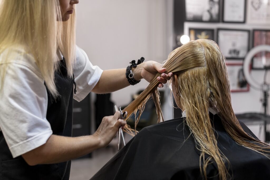 woman getting her hair cut beauty salon