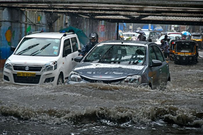 A Car Drives Past As It Rains At Andheri Subway In Mumbai, India