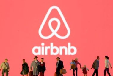 Small toy figures are seen in front of diplayed Airbnb logo in this illustration taken March 19, 2020. REUTERS/Dado Ruvic/Illustration Small toy figures are seen in front of diplayed Airbnb logo in this illustration taken March 19, 2020. REUTERS/Dado Ruvic/Illustration