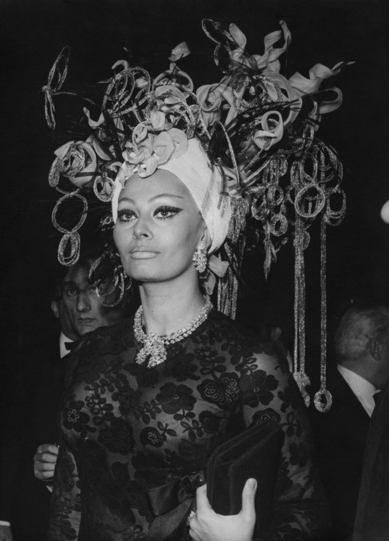 Sophia-Loren-arrives-at-a-grand-ball-at-the-casino-in-Monto-Carlo-Monaco-wearing-an-elaborate-headdress-on-March-16-1969-768x1067.jpg Sophia-Loren-arrives-at-a-grand-ball-at-the-casino-in-Monto-Carlo-Monaco-wearing-an-elaborate-headdress-on-March-16-1969-768x1067.jpg