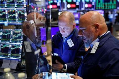 Traders work on the floor of the New York Stock Exchange (NYSE) in New York City, U.S., November 29, 2021. REUTERS/Brendan McDermid Traders work on the floor of the New York Stock Exchange (NYSE) in New York City, U.S., November 29, 2021. REUTERS/Brendan McDermid