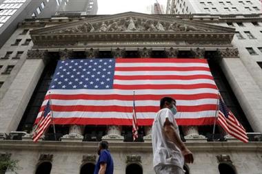 FILE PHOTO: People walk by the New York Stock Exchange (NYSE) in Manhattan, New York City, U.S., August 9, 2021. REUTERS/Andrew Kelly  FILE PHOTO: People walk by the New York Stock Exchange (NYSE) in Manhattan, New York City, U.S., August 9, 2021. REUTERS/Andrew Kelly