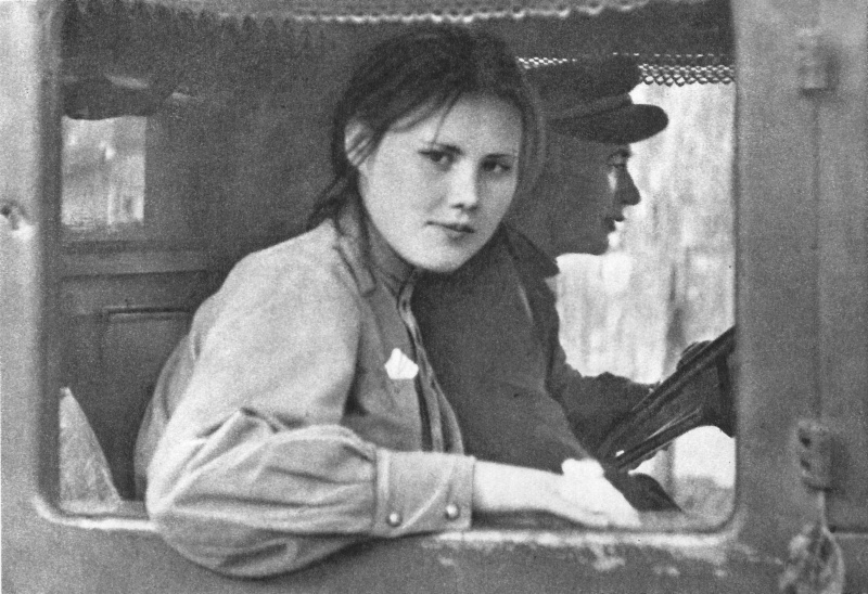 Девушка-военнослужащия из состава советских войск-освободителей Чехословакии в кабине грузовика. Прага, Чехословакия. Май 1945