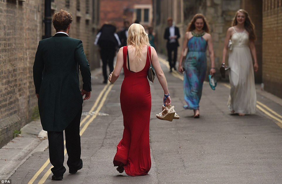 Finishing in style: The streets of Cambridge were filled with glamorous guests as the sun came up on Tuesday morning
