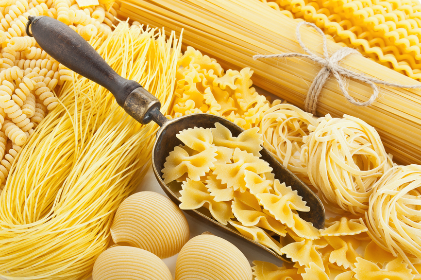 retro still life with assortment of uncooked pasta