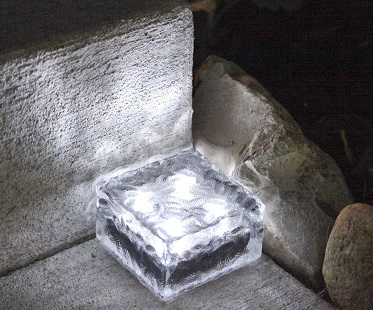 solar-powered-brick-lights-glass