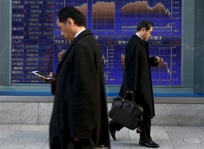 Men walk past an electronic board showing market indices outside a brokerage in Tokyo, Japan, March 2, 2016. Japan's Nikkei surged to a more than three-week high on Wednesday as the dollar rose against the yen after strong U.S. factory and construction data, giving exporters a boost and lifting the overall market. REUTERS/Thomas Peter Men walk past an electronic board showing market indices outside a brokerage in Tokyo, Japan, March 2, 2016. Japan's Nikkei surged to a more than three-week high on Wednesday as the dollar rose against the yen after strong U.S. factory and construction data, giving exporters a boost and lifting the overall market. REUTERS/Thomas Peter