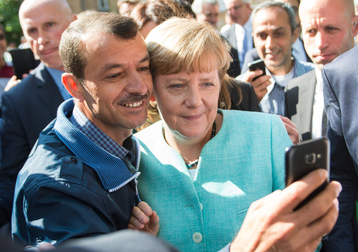 Меркель и беженцы