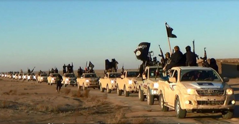 This image posted on a militant website on Tuesday, Jan. 7, 2014, which is consistent with AP reporting, shows a convoy of vehicles and fighters from the al-Qaida linked Islamic State of Iraq and the Levant (ISIL) fighters in Iraq's Anbar Province. With al-Qaida linked fighters and allied tribal gunmen camped on the outskirts, a tentative calm took hold over Fallujah on Friday, Jan. 10, 2014 and residents started to return to the besieged city west of Baghdad. Government forces were stationed nearby as sporadic street fighting breaks out in other cities. The picture painted by residents, officials and international groups suggests that both the militants and government forces are preparing for a long standoff with civilians caught in the middle.(AP Photo via militant website)