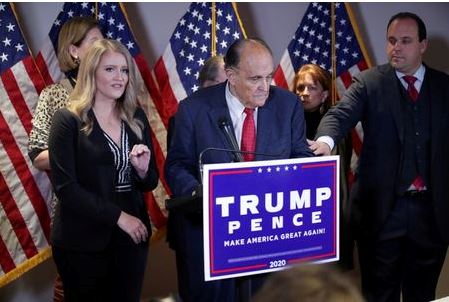 Trump Campaign Senior Legal Advisor Jenna Ellis speaks as Trump campaign advisor Boris Epshteyn reaches out to former New York City Mayor Rudy Giuliani, personal attorney to U.S. President Donald Trump, during a news conference about the 2020 U.S. presidential election results at Republican National Committee headquarters in Washington, U.S., November 19, 2020. REUTERS/Jonathan Ernst Trump Campaign Senior Legal Advisor Jenna Ellis speaks as Trump campaign advisor Boris Epshteyn reaches out to former New York City Mayor Rudy Giuliani, personal attorney to U.S. President Donald Trump, during a news conference about the 2020 U.S. presidential election results at Republican National Committee headquarters in Washington, U.S., November 19, 2020. REUTERS/Jonathan Ernst
