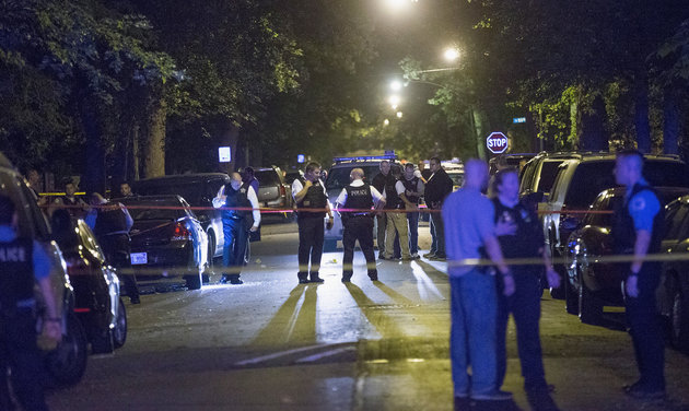 <span class='image-component__caption' itemprop="caption">Chicago police investigate a shooting scene where five people, including an 11-month-old child, were killed or injured on Sept. 28, 2015.</span>