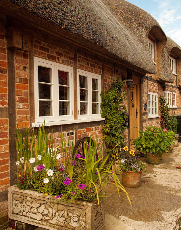 Flowers outside thatched cottages in the village of St. Mary Bou