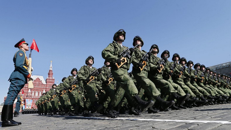 Vladimir Putin attends a military parade in Moscow