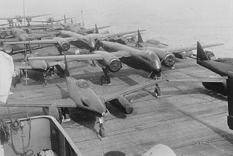 Rare picture of German Me-262 jet fighters aboard an aircraft carrier.  They're on the deck of the HMS Reaper on their way to the US to be  evaluated. An Arado Ar-234 was