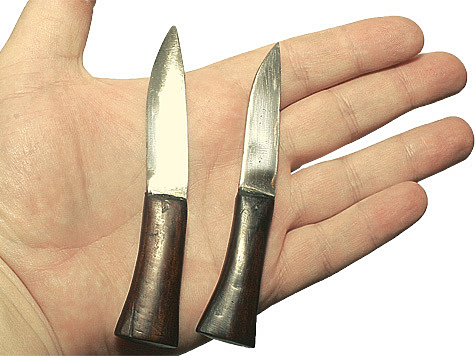 Two additional knives, one for smaller jobs, the second straightening kukri.