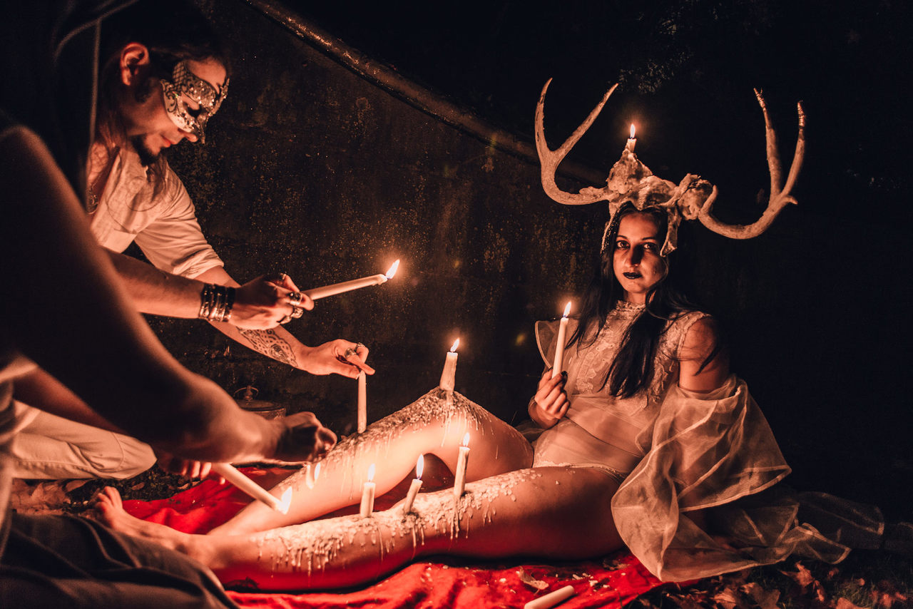 Living candelabras sat or stood unflinching as hot wax dripped onto their bodies, forming incredible sculptures and shapes.