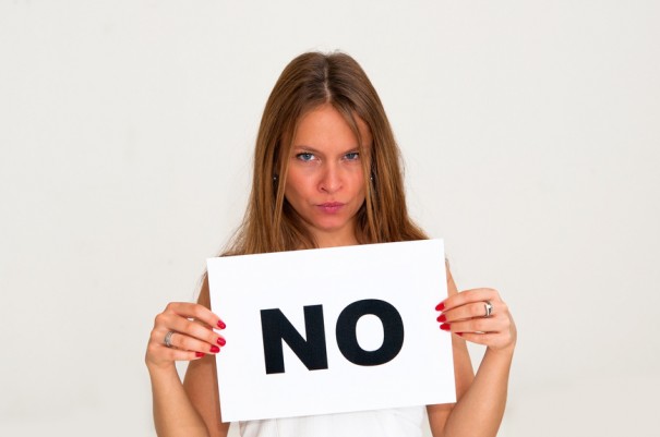 young woman with board NO