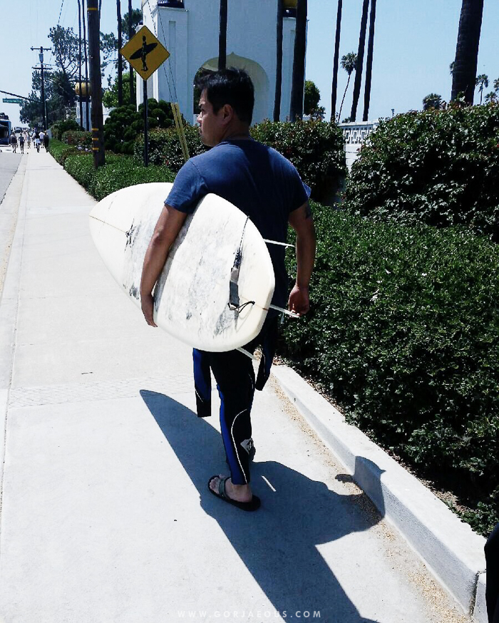 With the summer season coming to a close soon, here's a photo of Roan carrying a surfboard on the First Day of Summer. It's probably the heaviest surfboard ever; I was so scared it would hit my head when we went surfing with Patrick!