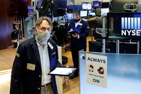 Traders wearing masks work, on the first day of in person trading since the closure during the outbreak of the coronavirus disease (COVID-19) on the floor at the New York Stock Exchange (NYSE) in New York, U.S., May 26, 2020. REUTERS/Brendan McDermid TPX IMAGES OF THE DAY Traders wearing masks work, on the first day of in person trading since the closure during the outbreak of the coronavirus disease (COVID-19) on the floor at the New York Stock Exchange (NYSE) in New York, U.S., May 26, 2020. REUTERS/Brendan McDermid TPX IMAGES OF THE DAY
