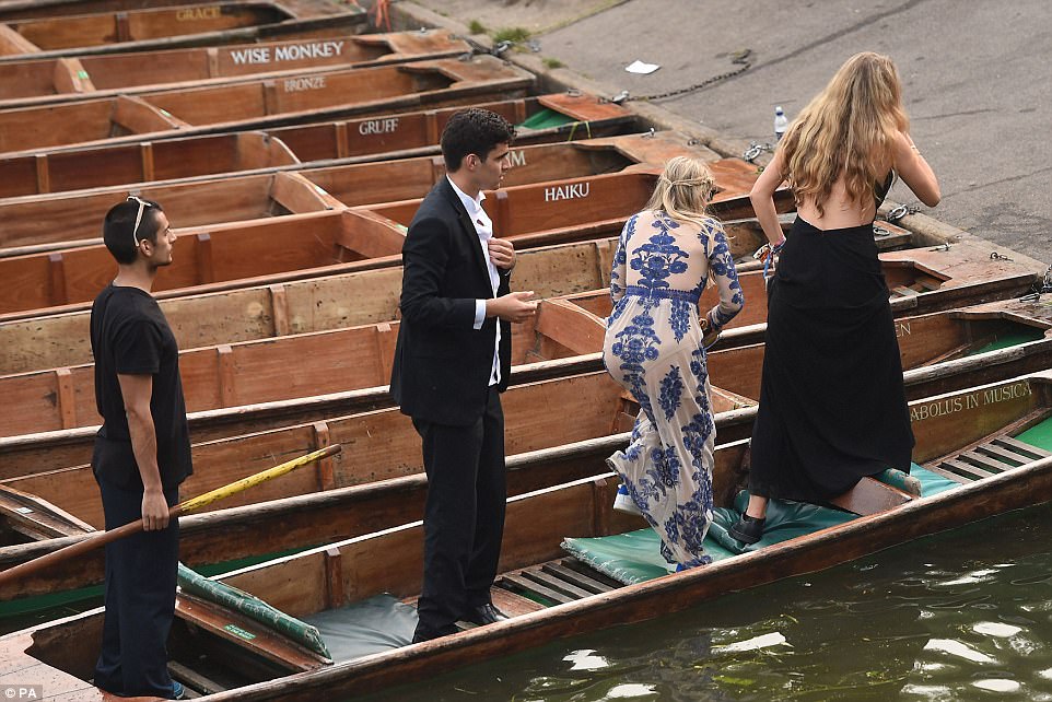 Time to call it a night: The group make their way back onto dry land after kicking back in a punt boat on Tuesday morning