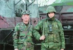 Офицер и рядовой из экипажа спецпоезда железнодорожных войск России. На заднем плане БРДМ-2, установленная на платформе СП «Байкал». Февраль 2002 г., Ханкала, Чеченская Республика СПЕЦПОЕЗДА В ЧЕЧНЕ: «БАЙКАЛ», «ТЕРЕК», «КОЗЬМА МИНИН» И ДРУГИЕ